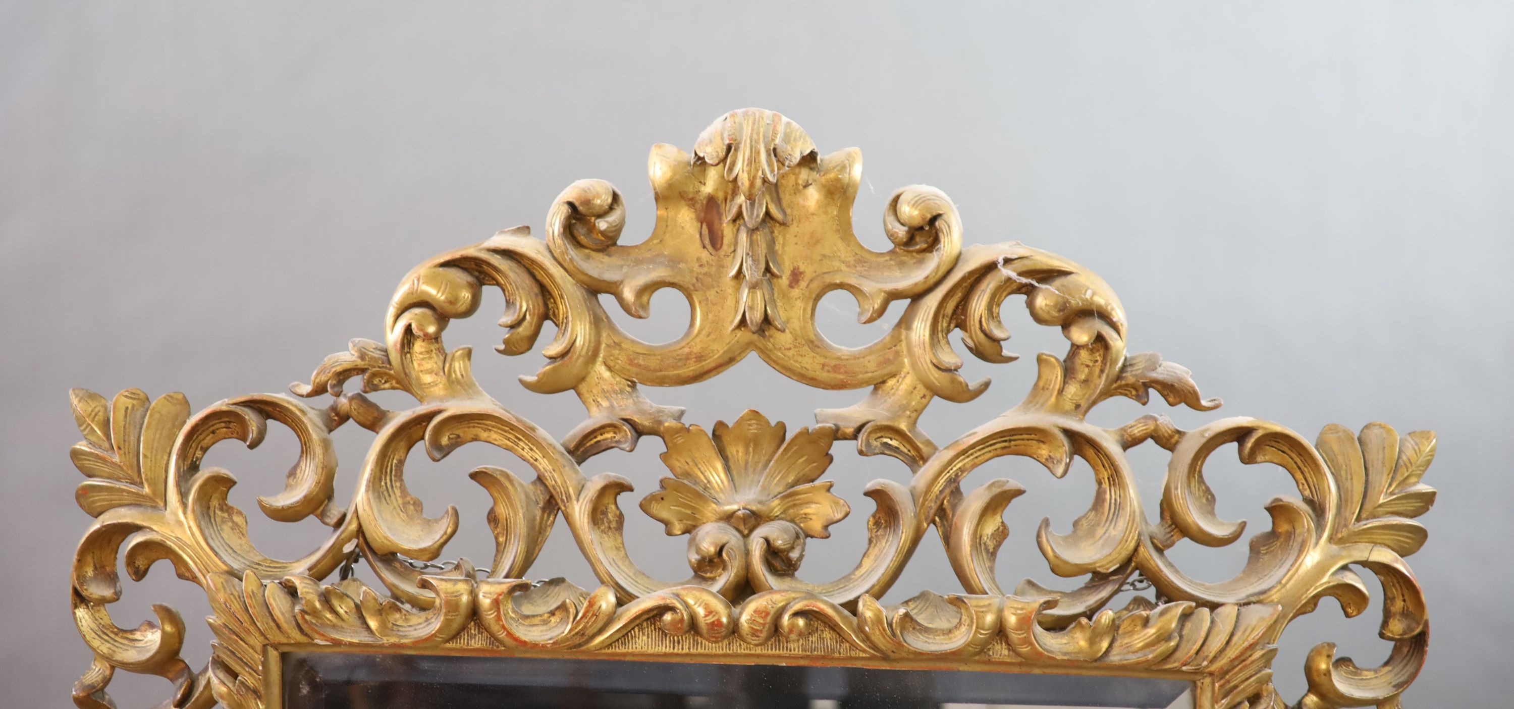 A late 19th century Florentine giltwood wall mirror, W.97cm H.138cm